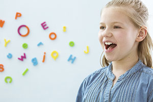 Girl with Speech, Language and Communication special needs in therapy