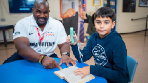 Kevin Brown with a pupil at Boldmere Junior School, in Sutton Coldfield.